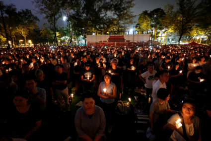 Thousands of people take part in a candlelight vigil to mark the 30th anniversary of the crackdown of pro-democracy movement at Beijing's Tiananmen Square in 1989, at Victoria Park in Hong Kong, China June 4, 2019. Photo by Tyrone Siu/Reuters