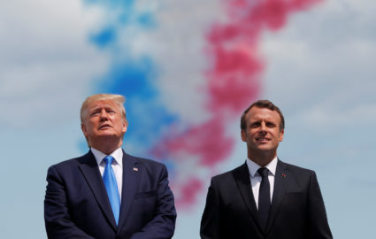 President Donald Trump and French President Emmanuel Macron look on in the Normandy American Cemetery to commemorate the 75th anniversary of the D-Day landings, Normandy, France. Photo by Carlos Barria/Reuters