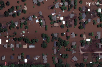 Record floods breach Arkansas levee, overtop 2 in Missouri