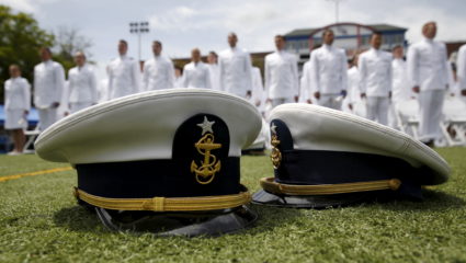 Graduates listen to closing remarks after tossing their caps in the air at the 134th Commencement Exercises of the United States Coast Guard Academy in New London, Connecticut in 2015. Photo by Kevin Lamarque/Reuters