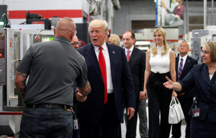 President Donald Trump shakes hands as he tours Waukesha County Technical College with his daughter Ivanka in Pewaukee, Wisconsin, on June 13, 2017. Union households made up an important part of Trump's voters in key Midwestern states. Kevin Lamarque/Reuters
