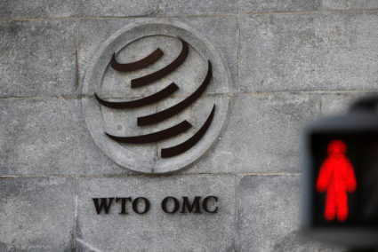 A logo is pictured outside the World Trade Organization (WTO) headquarters next to a red traffic light in Geneva, Switzerland, October 2, 2018. Photo by: Denis Balibouse/File Photo/Reuters