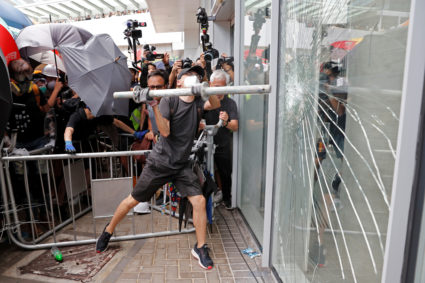 Protesters try to break into the Legislative Council building where riot police are seen, during the anniversary of Hong Kong's handover to China in Hong Kong on July 1, 2019. Photo by Tyrone Siu/Reuters