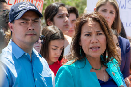 U.S. Representative Veronica Escobar (right) from El Paso speaks to the news media along with Rep. Joaquin Castro (left) and Rep. Alexandria Ocasio-Cortez (center) after they toured two Border patrol stations following reports of migrants kept in inadequate condtions, in Clint, Texas, on July 1, 2019. Photo by Julio-Cesar Chavez/Reuters
