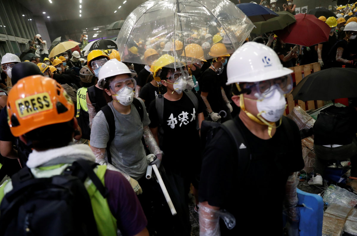 China backs Hong Kong leader, criticizes protesters for violence | PBS News