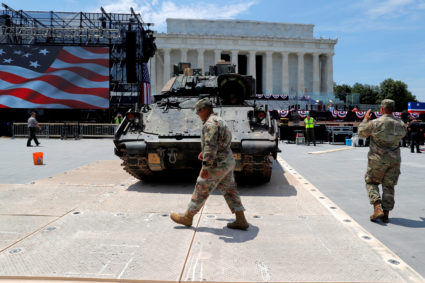 Members of the U.S. Army's 3rd Infantry Division, 1st Battalion, 64th Armored Regiment based at Fort Stewart, Georgia assist as a Bradley Fighting Vehicle is moved into place at the Lincoln Memorial ahead of a July Fourth celebration highlighting U.S. military might in Washington. Photo taken July 3, 2019. Photo by Jim Bourg/Reuters
