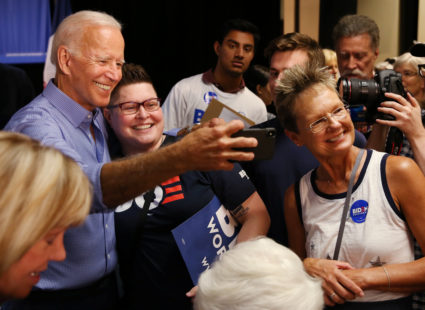 Democratic 2020 U.S. presidential candidate and former Vice President Joe Biden takes photos with supporters at a campaign event in Marshalltown, Iowa, on July 4, 2019. Photo by Brenna Norman/Reuters