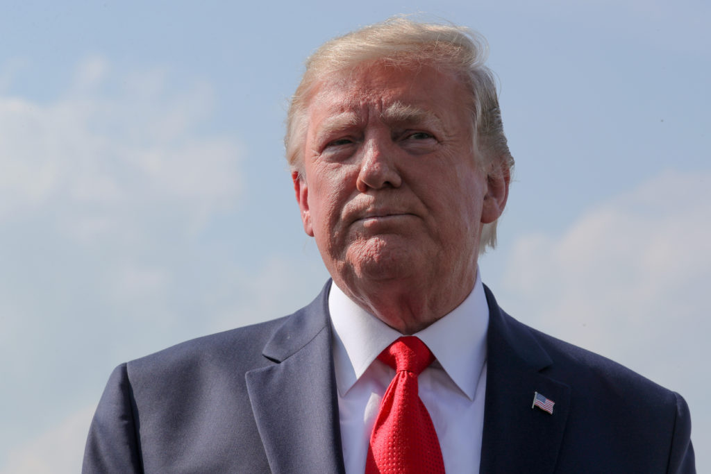 U.S. President Donald Trump talks to reporters before boarding Air Force One to return to Washington from Morristown Munic...