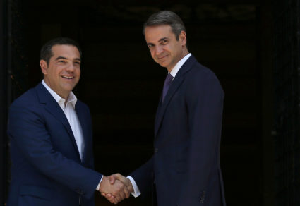 Newly-appointed Greek Prime Minister Kyriakos Mitsotakis shakes hands with outgoing Prime Minister Alexis Tsipras at the Maximos Mansion in Athens, Greece July 8, 2019. Photo by Costas Baltas/Reuters