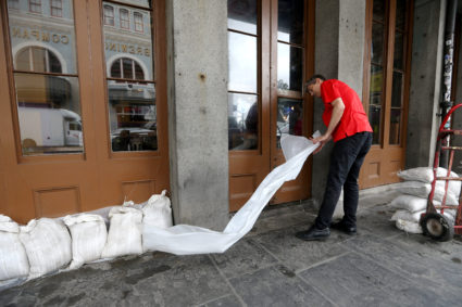 An employee places sandbags in front of a business in the French Quarter as Tropical Storm Barry approaches land in New Orleans, Louisiana, U.S. July 12, 2019. Photo by: Jonathan Bachman/Reuters