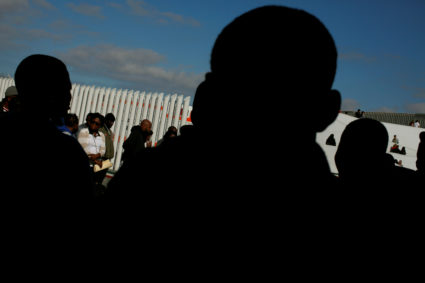 Migrants queue to apply for asylum in the United States, at El Chaparral port of entry, between Mexico and the United States border crossing, in Tijuana, Mexico, July 20, 2019. Photo by: Carlos Jasso/Reuters