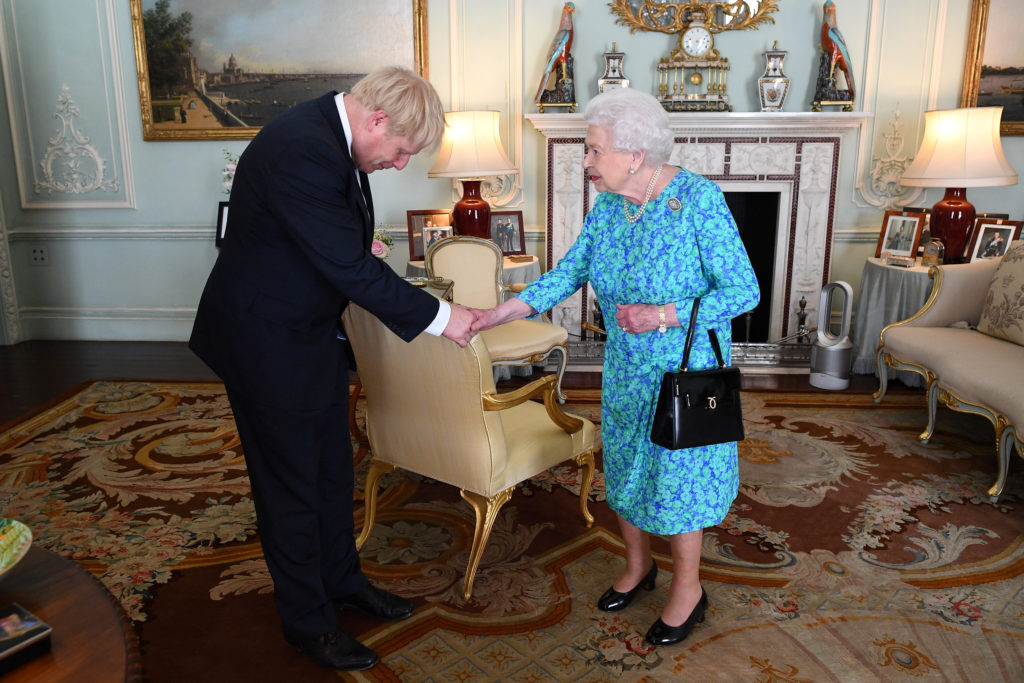 Queen Elizabeth II welcomes Boris Johnson during an audience in Buckingham Palace, where she will officially recognise him...