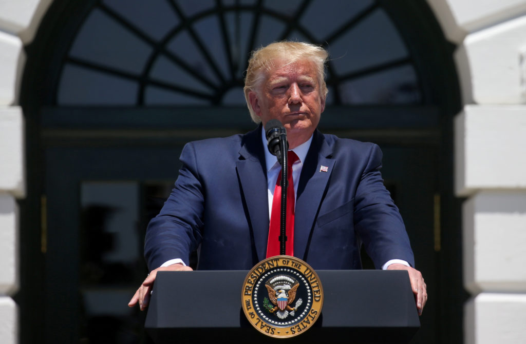 U.S. President Donald Trump answers questions from the media during the "3rd Annual Made in America Product Showcase" on t...