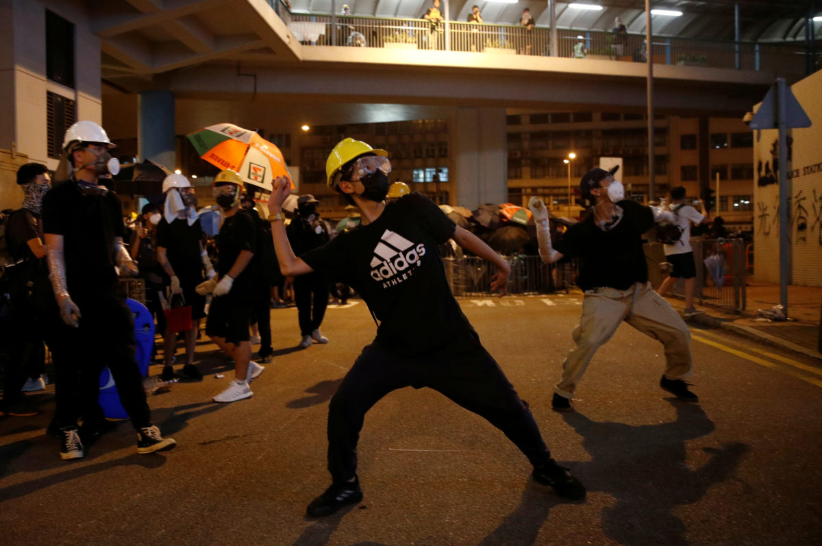 Hong Kong residents deface Chinese emblem in latest protest | PBS News ...