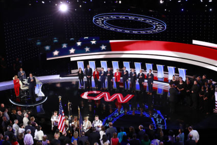 The candidates stand during the national anthem on the first night of the second 2020 Democratic U.S. presidential debate July 30 in Detroit, Michigan. REUTERS/Lucas Jackson