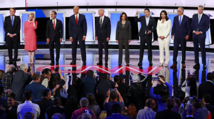 Democratic 2020 U.S. presidential candidates (L-R) U.S. Senator Michael Bennet, U.S. Senator Kirsten Gillibrand, former HUD Secretary Julian Castro, U.S. Senator Cory Booker, former Vice President Joe Biden, U.S. Senator Kamala Harris, entrepreneur Andrew Yang, U.S. Rep. Tulsi Gabbard, Washington Governor Jay Inslee and New York City Mayor Bill de Blasio pose together before the start of the second night of the second U.S. 2020 presidential Democratic candidates debate in Detroit, Michigan, July 31, 2019. REUTERS/Lucas Jackson