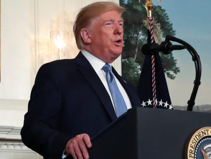 Trump suggests linking immigration reform to stronger gun checks, but offers no details
