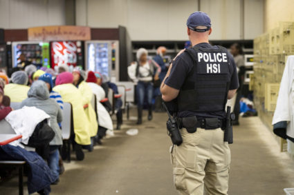 Homeland Security Investigations (HSI) officers from Immigration and Customs Enforcement (ICE) look on after executing search warrants and making arrests at an agricultural processing facility in Canton, Mississippi, U.S. in this August 7, 2019 handout photo. Photo courtesy: Immigration and Customs Enforcement/Handout via Reuters