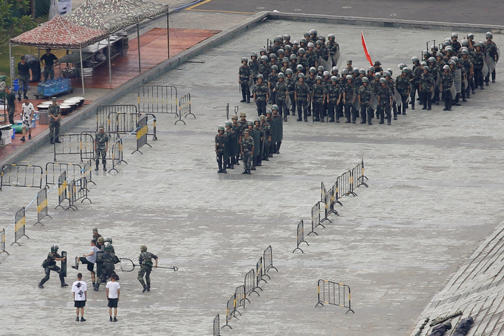 Chinese servicemen attend a crowd control exercise at the Shenzhen Bay Sports Center in Shenzhen across the bay from Hong ...