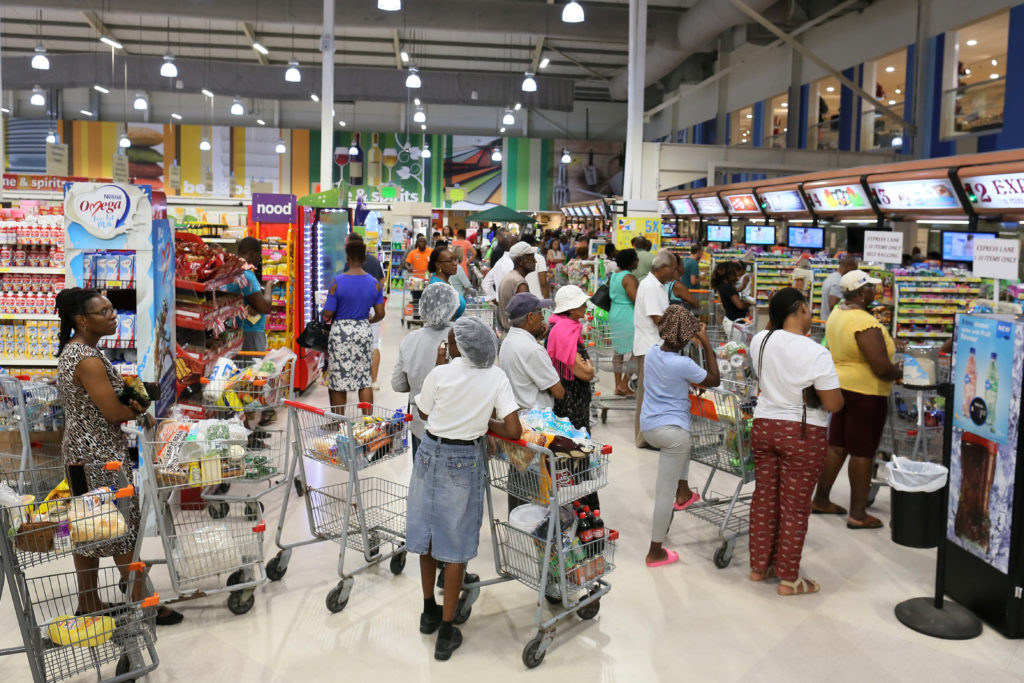 Shoppers preparing for the arrival of Tropical Storm Dorian crowd a supermarket in Bridgetown, Barbados August 25, 2019. P...