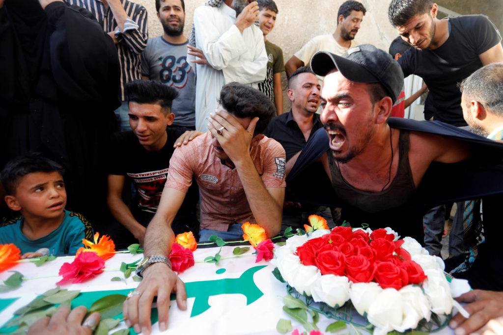 Relatives of Kazem Ali Mohssen, a brigade commander of the Popular Mobilisation Forces, who was killed by an unmanned airc...