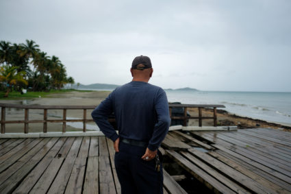 A man surveys the beach as Tropical Storm Dorian approaches in Humacao, Puerto Rico August 28, 2019. Photo by Ricardo Arduengo/Reuters