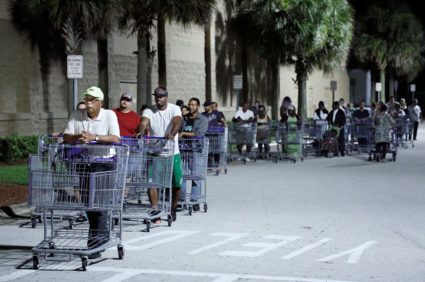 Shoppers wait in a long line for a Sam's Club store to open before sunrise, as people rushed to buy supplies ahead of the arrival of Hurricane Dorian in Kissimmee, Florida, on August 29, 2019. Photo by Gregg Newton/Reuters