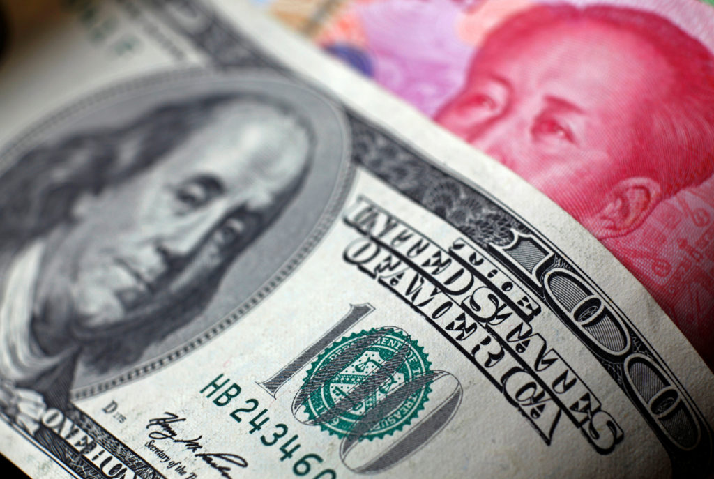 The move came a day after Beijing sent financial markets tumbling by allowing the currency to fall to an 11-year low. Phot...