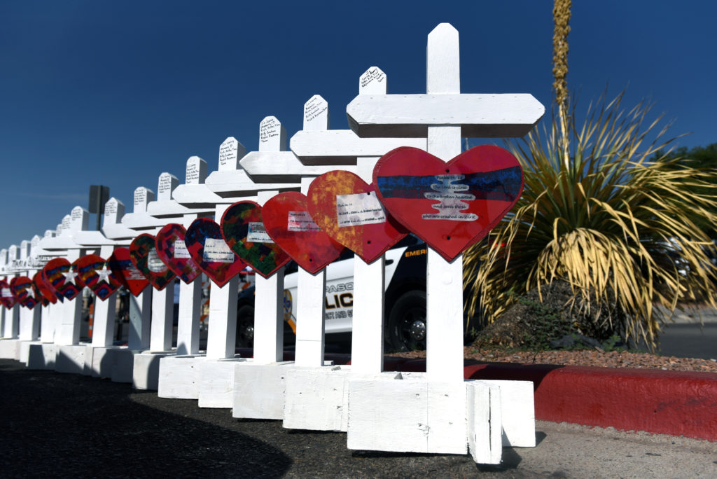 A cross for each of the victims waits to be taken to a growing memorial site two days after a mass shooting at a Walmart s...