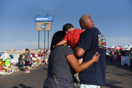 Norma, Luke and Mark Jimerson pay their respects at a memorial four days after a mass shooting at a Walmart store in El Paso, Texas, U.S. August 7, 2019. Photo by Callaghan O'Hare/Reuters