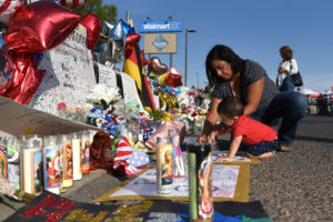Norma and Luke Jimerson pay their respects at a memorial four days after a mass shooting at a Walmart store in El Paso, Texas, U.S. August 7, 2019. REUTERS/Callaghan O'Hare