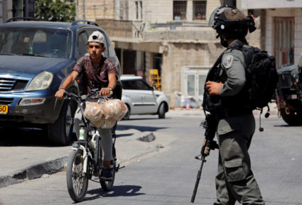 Israeli troops search West Bank after killing of soldier