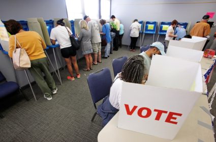 People cast their ballots for the 2016 general elections at a crowded polling station as early voting begins in North Carolina, in Carrboro, North Carolina, U.S., October 20, 2016. Photo by Jonathan Drake/Reuters