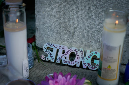 Candles burn as part of a memorial at the scene of Sunday mornings mass shooting in Dayton, Ohio, U.S. August 5, 2019. REUTERS/Bryan Woolston