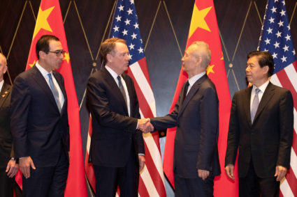 U.S. Trade Representative Robert Lighthizer shakes hands with Chinese Vice Premier Liu He as U.S. Treasury Secretary Steven Mnuchin and China's Commerce Minister Zhong Shan look on during a family photo at the Xijiao Conference Center in Shanghai, China, July 31, 2019. Ng Han Guan/Pool via Reuters