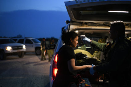 Nely, a Honduran migrant seeking asylum with her family, receives a medical evaluation from a U.S. Border Patrol agent trained as an emergency medical technician (EMT) after illegally crossing the Rio Grande and turning herself in to law enforcement in Hidalgo, Texas, U.S., August 23, 2019. Picture taken August 23, 2019. Photo by Loren Elliott/Reuters