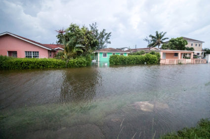 Houses line a flooded street after the effects of Hurricane Dorian arrived in Nassau, Bahamas, September 2, 2019. Photo by John Marc Nutt/Reuters
