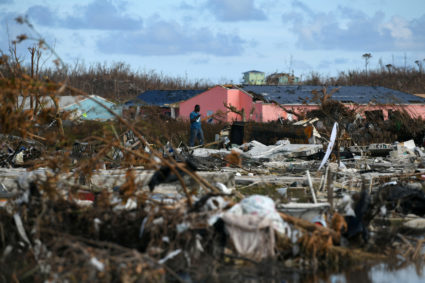 A man searches for belongings amongst debris in a destroyed neighborhood in the wake of Hurricane Dorian in Marsh Harbour, Great Abaco, Bahamas, September 8, 2019. Photo by Loren Elliott/Reuters