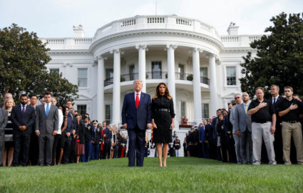 U.S. President Donald Trump and first lady Melania Trump observe a moment of silence to mark the 18th anniversary of September 11 attacks on the South Lawn of the White House in Washington, U.S., September 11, 2019. Photo by Kevin Lamarque/Reuters