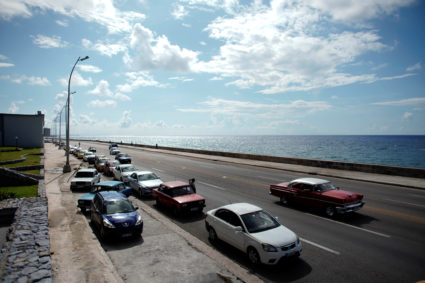 Cars line up for gas at the seafront Malecon in Havana, Cuba, September 17, 2019. Photo by Alexandre Meneghini/Reuters
