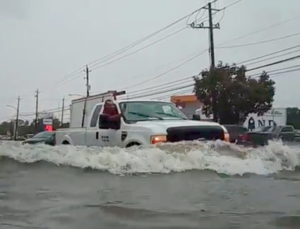 A car passes through a flooded street as storm Imelda hits Houston, Texas, U.S., September 19, 2019 in this screen grab obtained from social media video. Photo courtesy: @kingjames.daniel/via Reuters