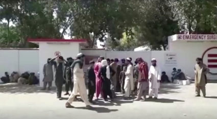 Relatives of a wedding party victims wait outside the emergency hospital in Helmand, Afghanistan September 23, 2019, in this still image taken from a video. Reuters TV via REUTERS