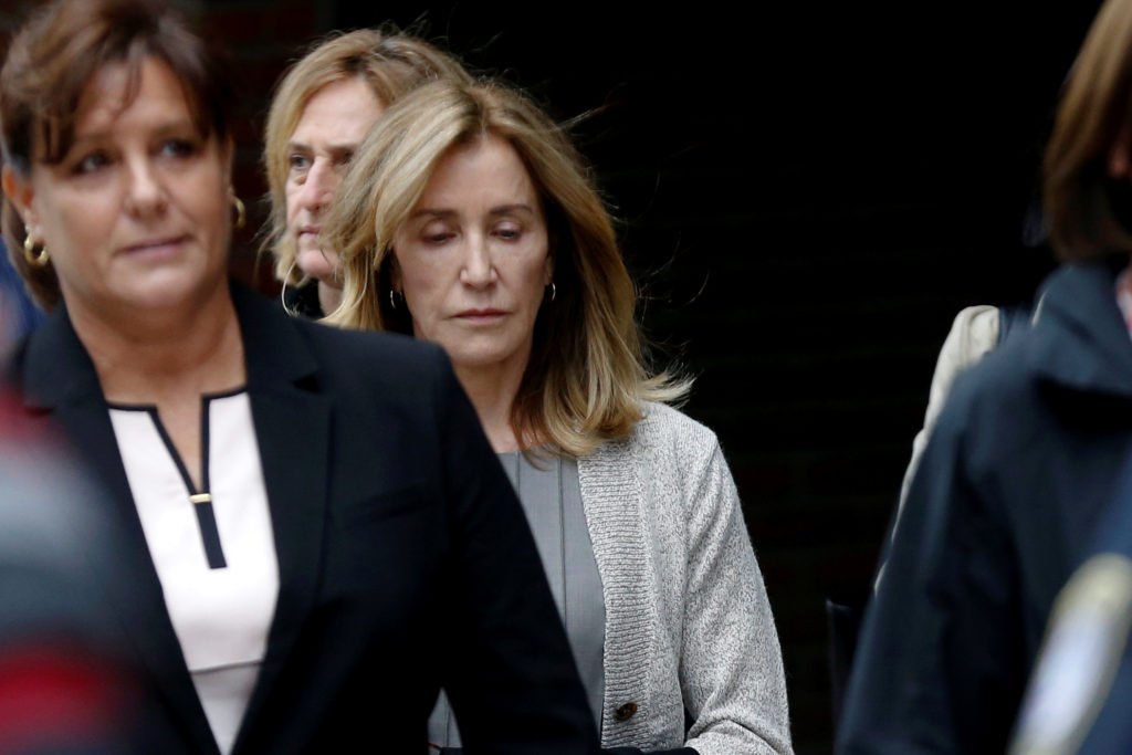 Actor Felicity Huffman leaves the federal courthouse after facing charges in a nationwide college admissions cheating sche...