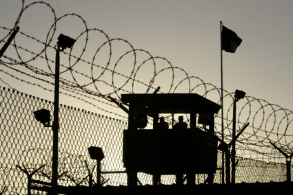 U.S. Army troops stand guard over Sally Port One at Camp Delta where detainees are held at the United States Naval Base in Guantanamo Bay, Cuba January 18, 2006. About 500 detainees captured as part of Operation Enduring Freedom during the war in Afghanistan are held in the prison's complexes.