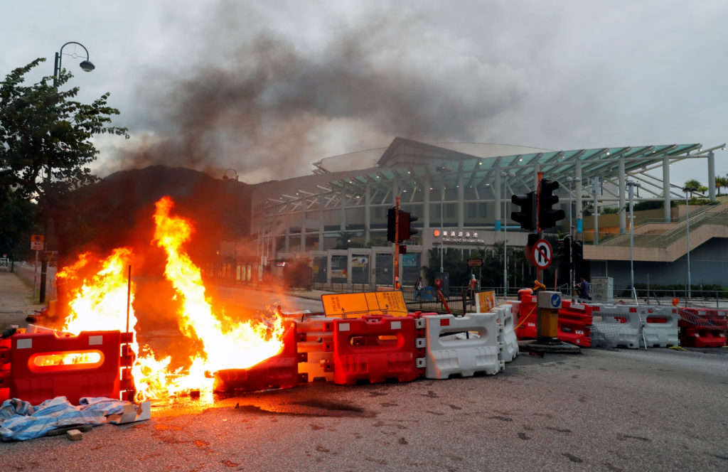 A burning barricade near a Hong Kong metro station. Photo by Anushree Fadnavis/Reuters