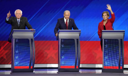 Senator Bernie Sanders, former Vice President Joe Biden and Senator Elizabeth Warren (L-R) try to get the moderators attention at the 2020 Democratic U.S. presidential debate in Houston, Texas, U.S. September 12, 2019. REUTERS/Mike Blake - HP1EF9D047T54