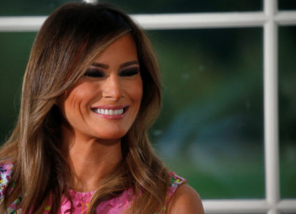 First lady Melania Trump listens as her husband U.S. President Donald Trump speaks at a dinner with business leaders at Trump National Golf Club in Bedminster, New Jersey, U.S., August 7, 2018. Photo by Leah Millis/Reuters