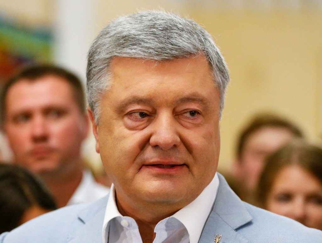 Ukraine's former President and leader of the European Solidarity party Petro Poroshenko speaks at a polling station during...