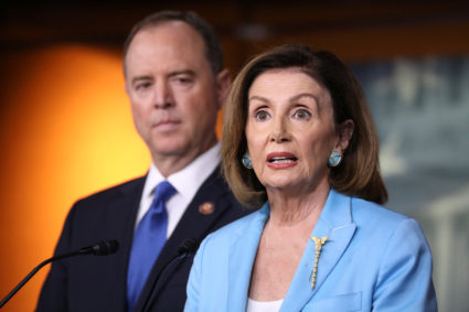 U.S. House Speaker Nancy Pelosi (D-CA) addresses reporters as House Intelligence Committee Chairman Adam Schiff (D-CA) listens during Pelosi's weekly news conference at the U.S. Capitol in Washington, U.S., October 2, 2019. Photo by Jonathan Ernst/Reuters