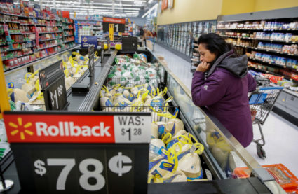 FILE PHOTO: A customer shops for a turkey at a Walmart store in Chicago, Illinois, U.S., November 20, 2018. Photo by Kamil Krzaczynski/Reuters